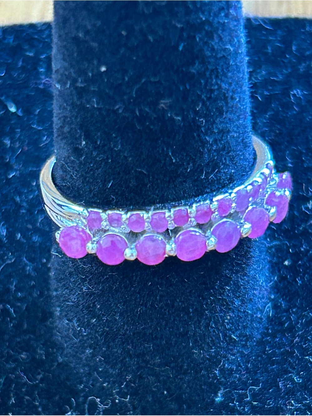 Natural ruby and sterling silver marked double row half eternity stacker ring.